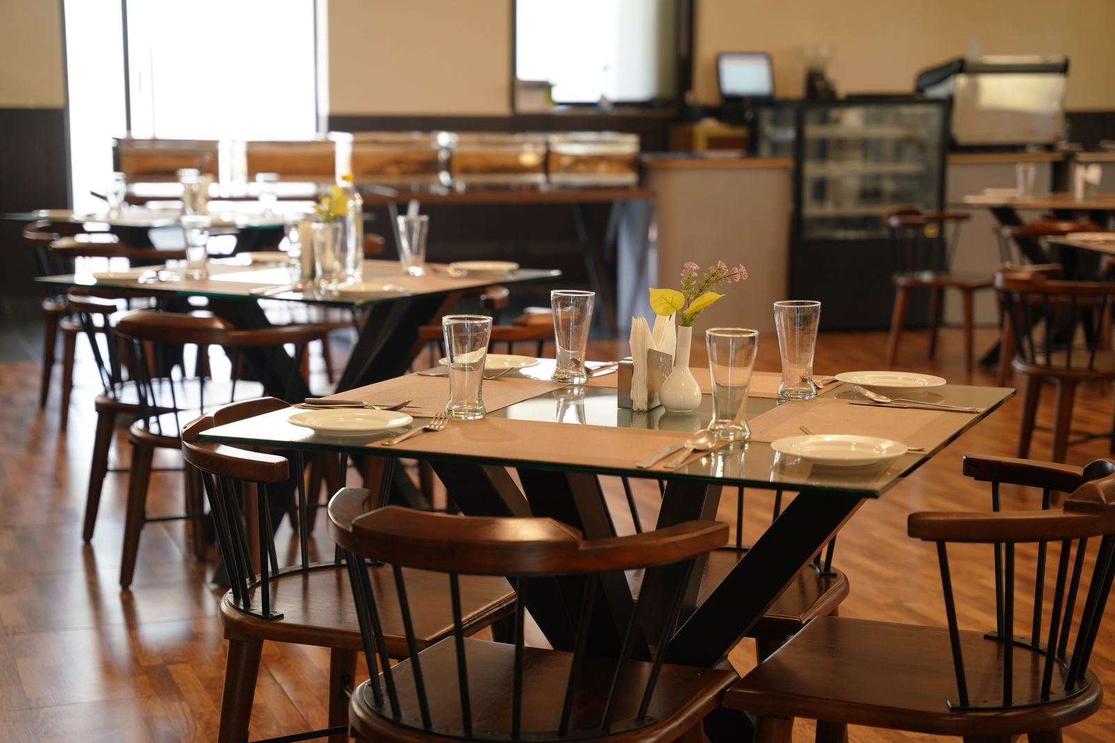 A warm restaurant dining room set and ready for service, the goal every restaurant grand opening is building toward